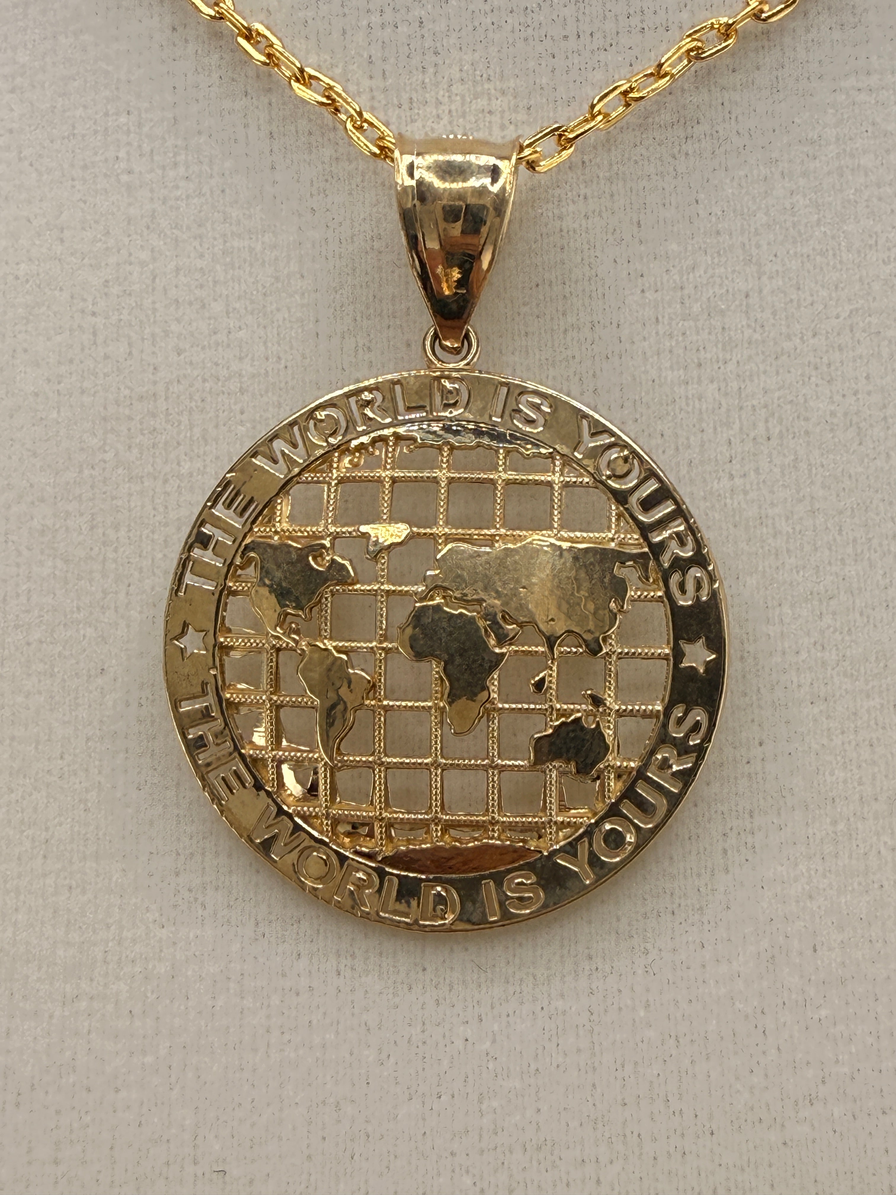 14K Gold “The World Is Yours” Map Pendant