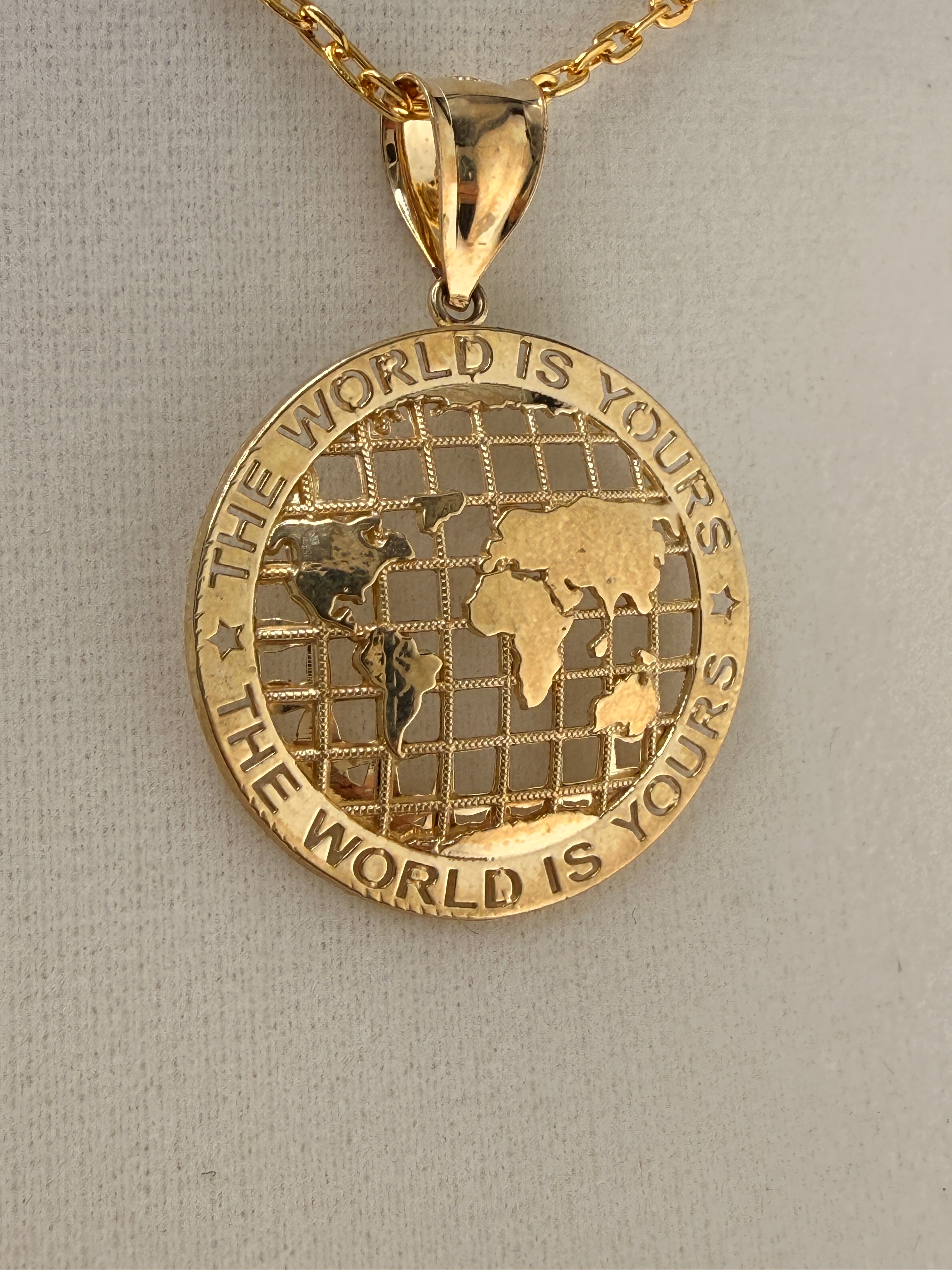14K Gold “The World Is Yours” Map Pendant