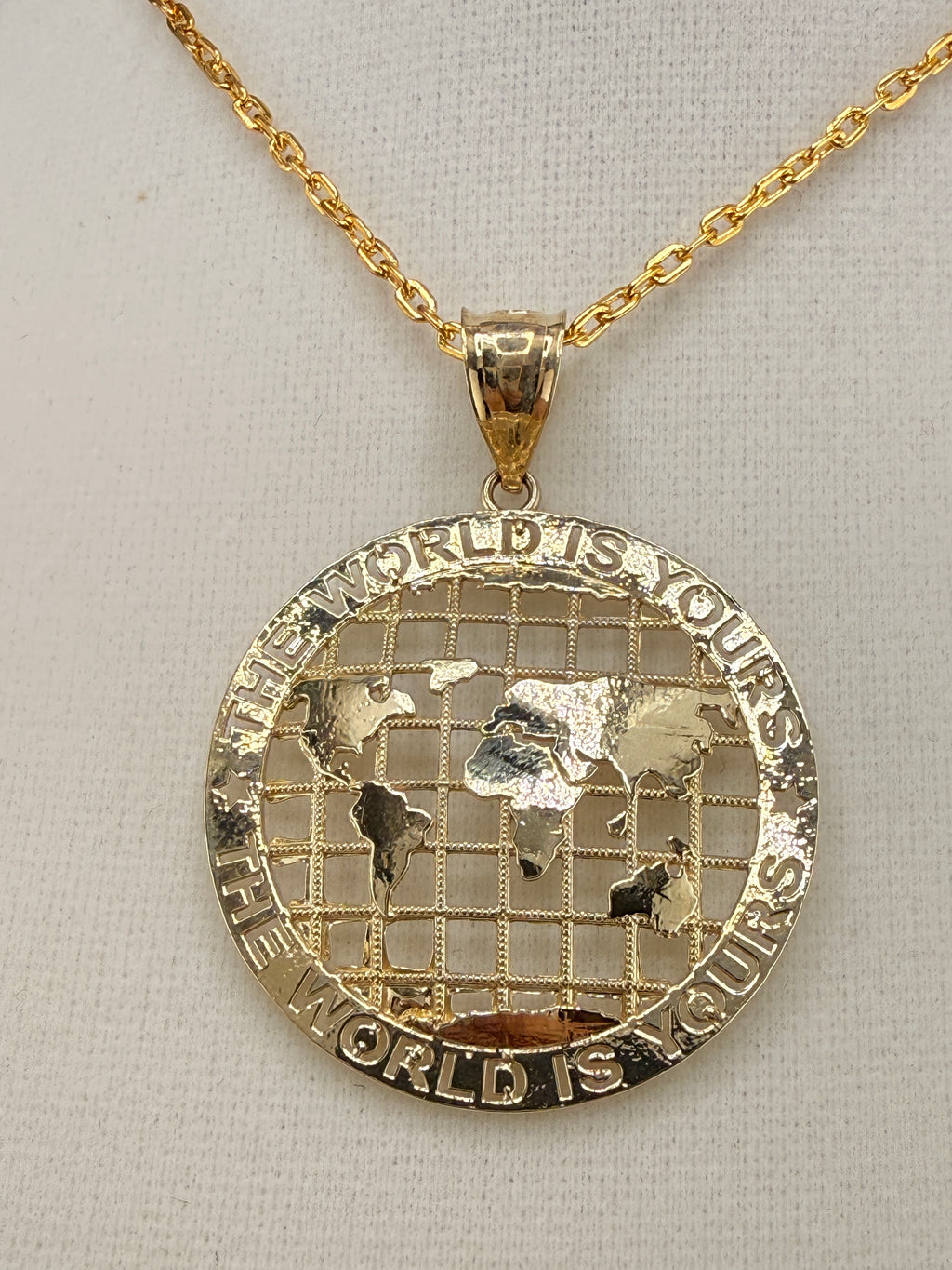 10K Solid Gold “The World Is Yours” Map Pendant